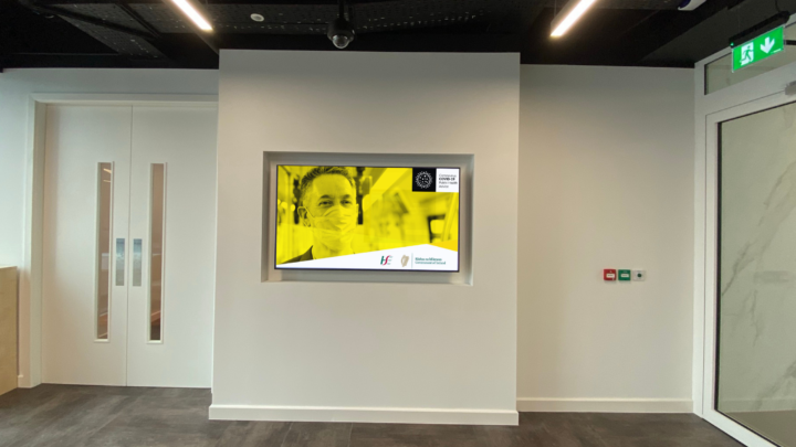 Digital signage in reception areas letting visitors know how the business is responding to COVID-19 guidelines.